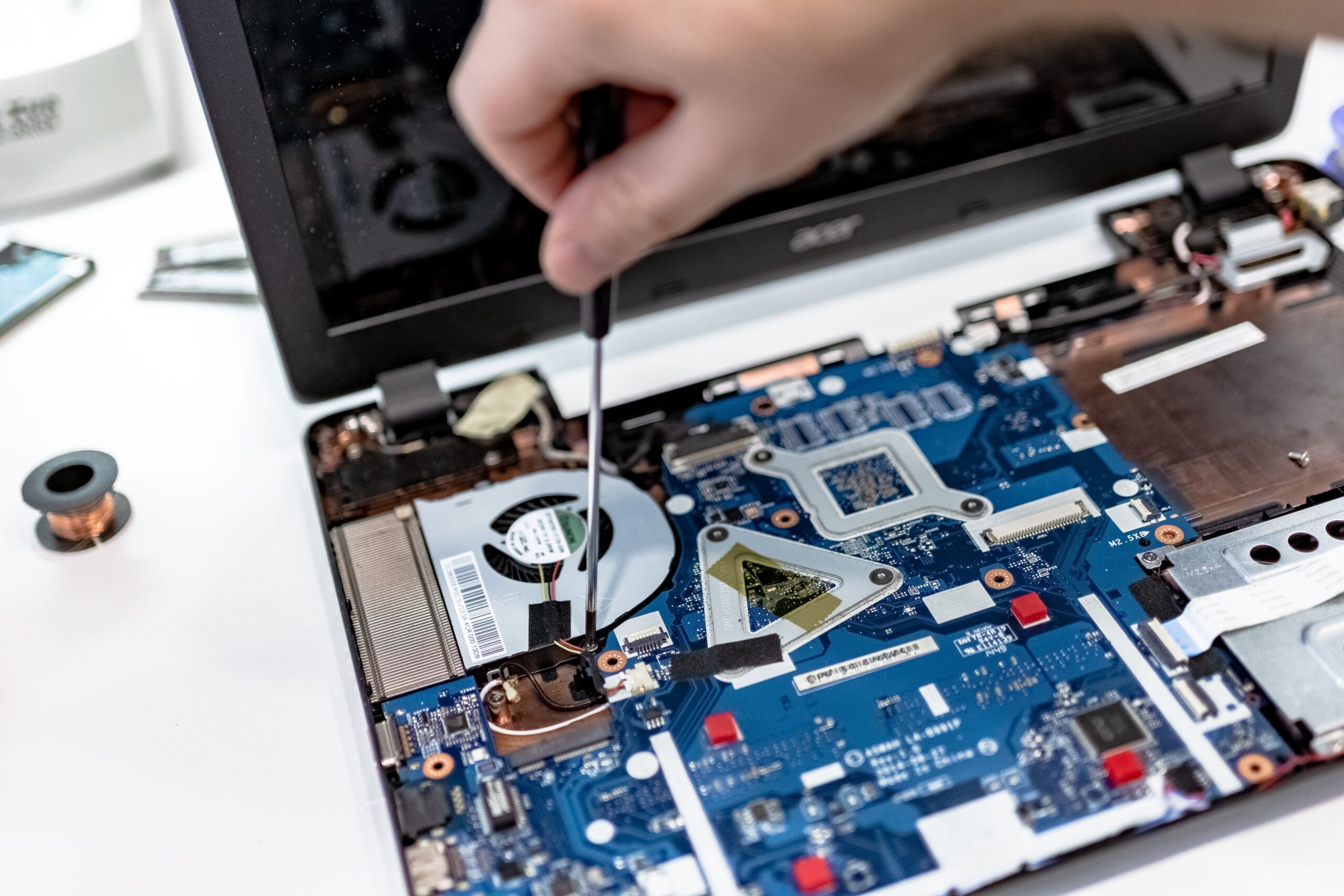 Technician performing computer hardware maintenance